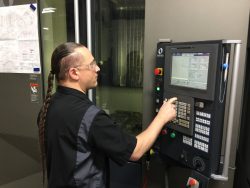 man programming finish CNC mill